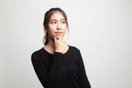 Serious  young Asian woman  look away on white backgroundの写真素材