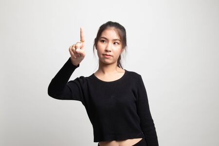 Asian woman touching the screen with her finger on white backgroundの写真素材