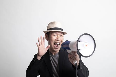 Adult Asian man  announce with megaphone on white background