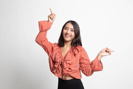 Young Asian woman point with two hands on white backgroundの写真素材