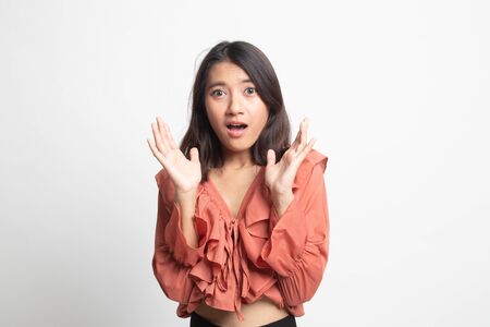 Shocked young Asian woman on white backgroundの写真素材