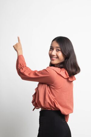 Back of Asian woman touching the screen with her finger on white backgroundの写真素材