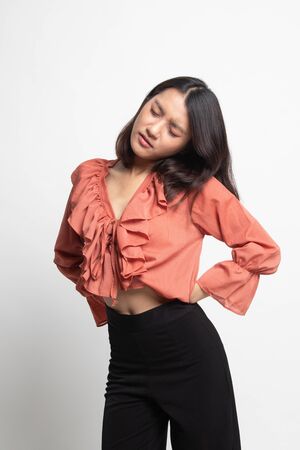 Young Asian woman got back pain on white backgroundの写真素材