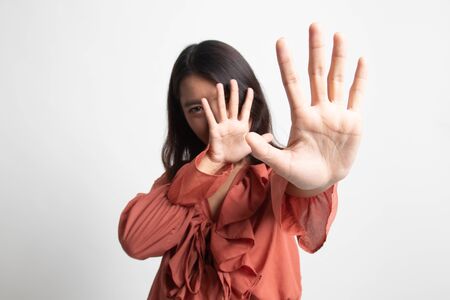 Young Asian woman hide her  face on white backgroundの写真素材