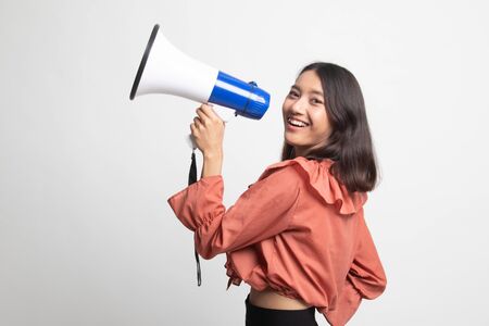 Beautiful young Asian woman announce with megaphone on white backgroundの写真素材