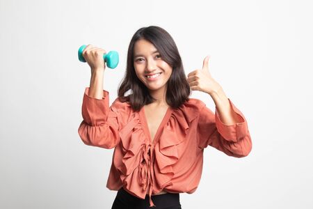 Healthy Asian woman thumbs up with dumbbells on white backgroundの写真素材