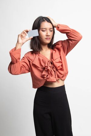 Young Asian woman headache with a blank card on white backgroundの写真素材