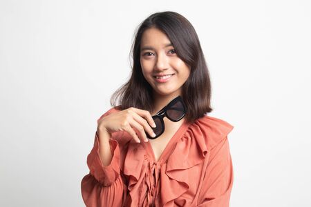 Portrait of a beautiful young asian girl with  sunglasses on white backgroundの写真素材