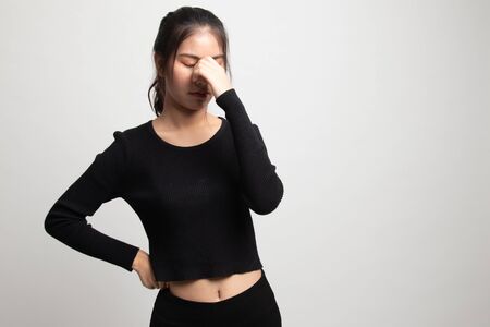 Young Asian woman got sick and  headache on white backgroundの写真素材