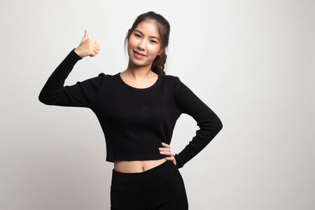 Young Asian woman show thumbs up on white backgroundの写真素材