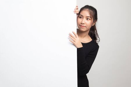 Young Asian woman with blank sign on white backgroundの写真素材