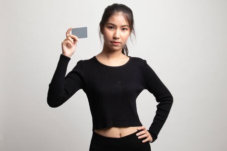 Young Asian woman with a blank card on white backgroundの写真素材