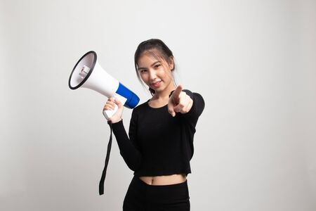 Beautiful young Asian woman announce with megaphone on white backgroundの写真素材