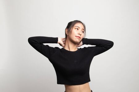 Sleepy young Asian woman yawn on white backgroundの写真素材