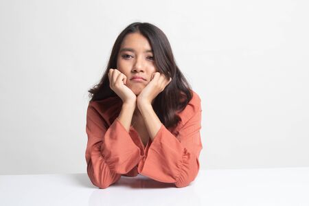 Asian girl with sad emotion on white backgroundの写真素材