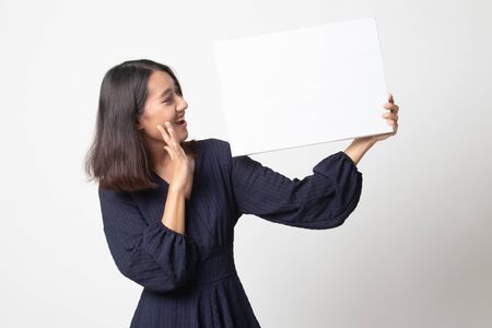 Young Asian woman  surprise with  white blank sign on white backgroundの写真素材