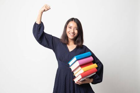 Young Asian woman studying  with may books on white backgroundの写真素材