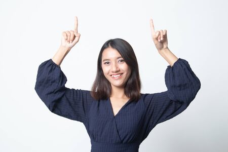 Young Asian woman point to blank space on white backgroundの写真素材