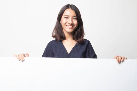 Young Asian woman with blank sign on white backgroundの写真素材