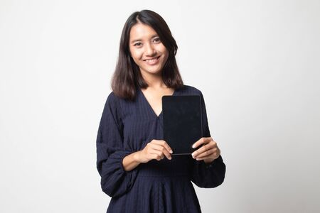 Young Asian woman with a computer tablet on white backgroundの写真素材
