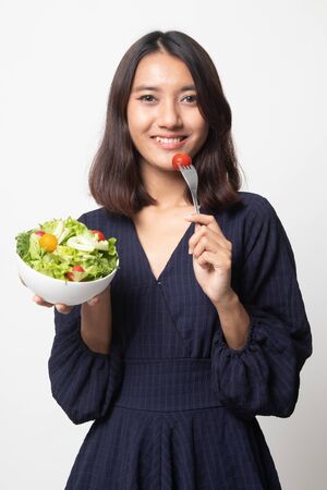 Healthy Asian woman with salad on white backgroundの写真素材