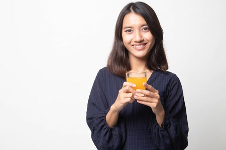 Young Asian woman drink orange juice on white backgroundの写真素材