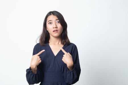 Young Asian woman point at herself ask why me on white backgroundの写真素材