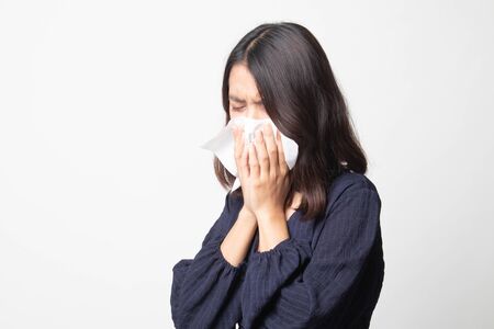 Young Asian woman got sick and flu on white backgroundの写真素材