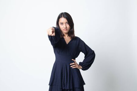 Young Asian woman angry and point to camera on white backgroundの写真素材