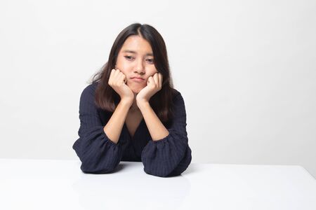 Asian girl with sad emotion on white backgroundの写真素材