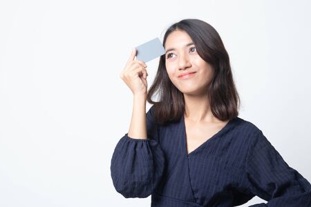 Young Asian woman think with a blank card on white backgroundの写真素材