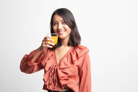 Young Asian woman drink orange juice on white backgroundの写真素材