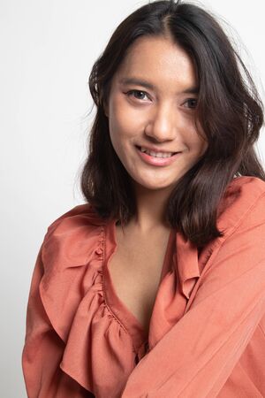 Portrait of beautiful young Asian woman on white backgroundの写真素材