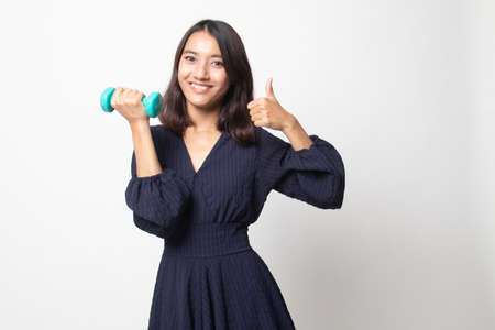 Healthy Asian woman thumbs up with dumbbells on white backgroundの写真素材