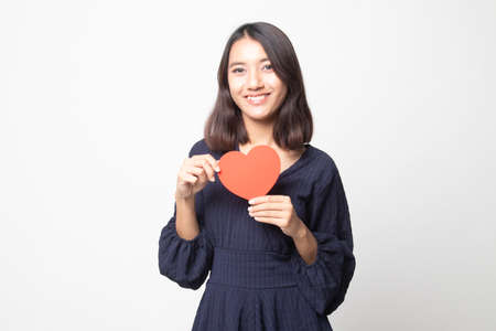 Asian woman with red heart on white backgroundの写真素材
