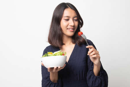Healthy Asian woman with salad on white background