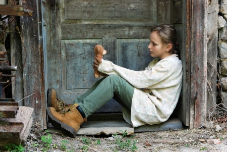 Sad little girl feels lonely の写真素材