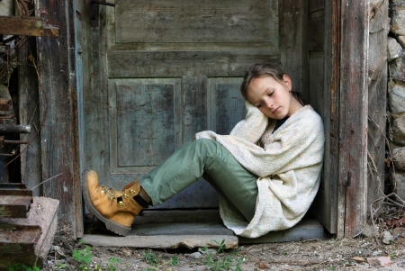 Sad little girl feels lonely の写真素材
