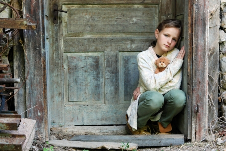 Sad little girl feels lonely の写真素材