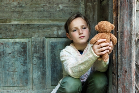 Sad little girl feels lonely の写真素材