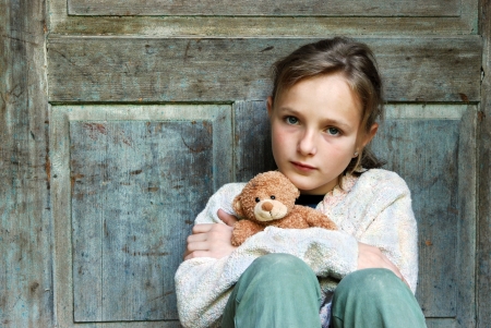 Sad little girl feels lonely の写真素材