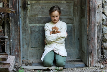 Sad little girl feels lonely の写真素材