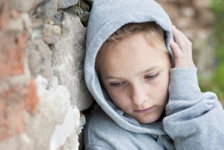 Little sad child with hoody.の写真素材