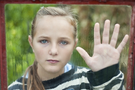 Sad young girl feels lonely.の写真素材