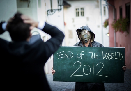 Business man is scared of the end of the worldの写真素材