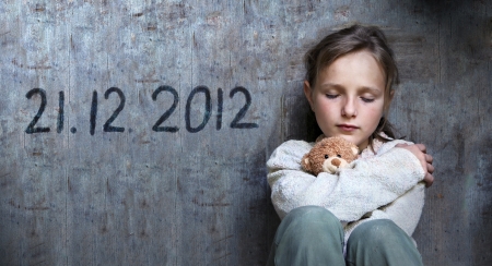 Frightened child with date of end of the world.の写真素材