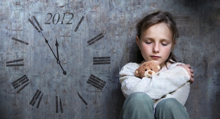 Frightened child with date of end of the world.の写真素材