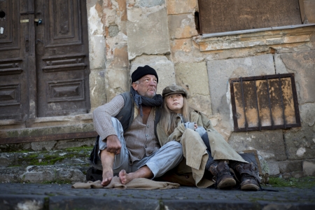 Homeless family is begging on the streetの写真素材