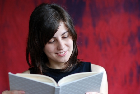 Girl with book si studying の写真素材