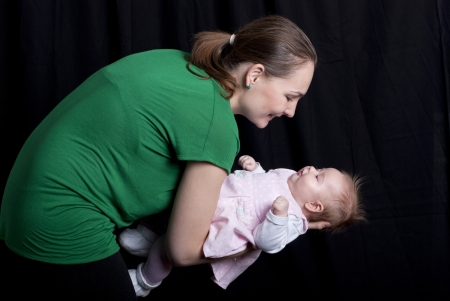 Little baby is having fun with mother.の写真素材